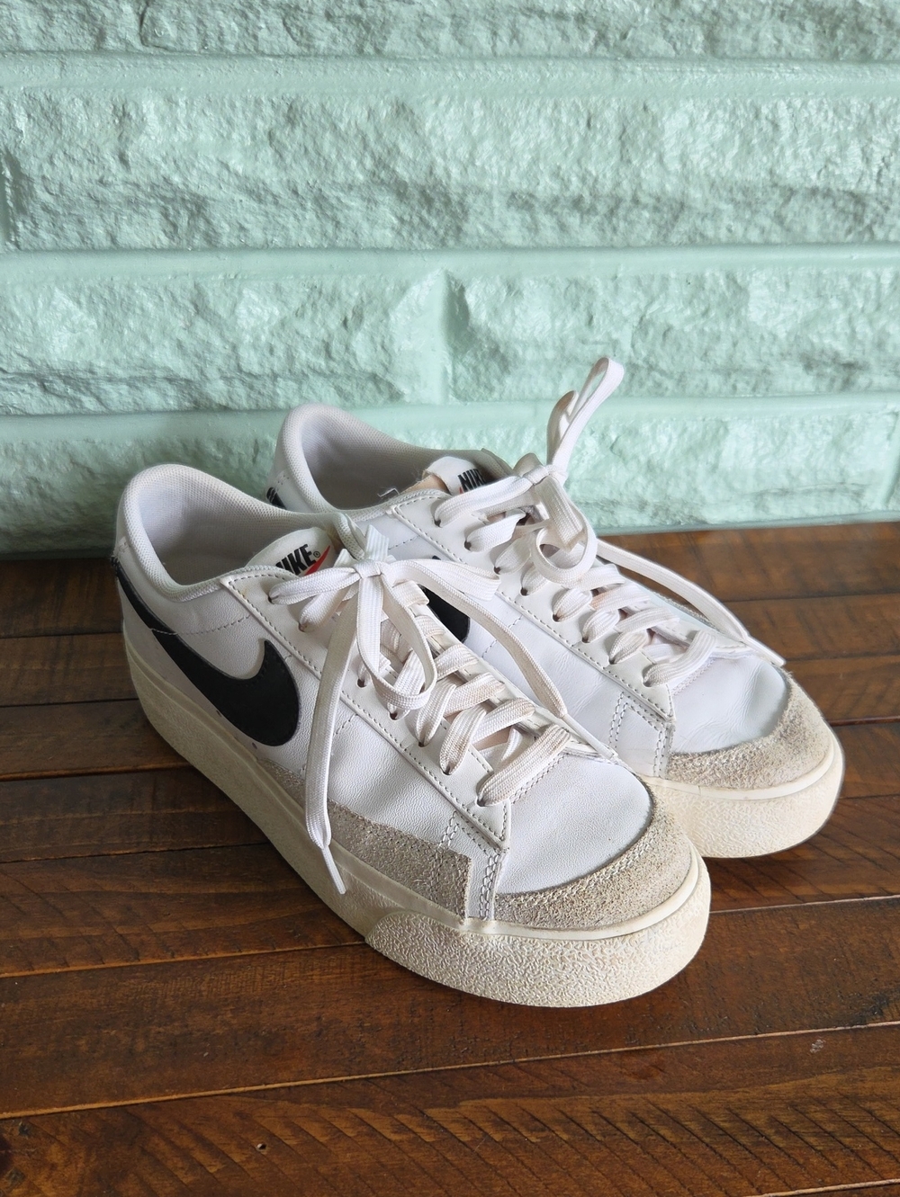 Nike Women's Classic White Low Sneakers with Black Swoosh Size 7